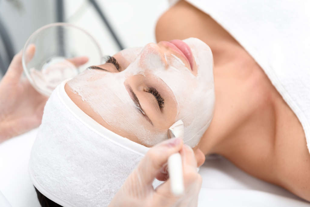 Relaxed young woman enjoying spa procedure