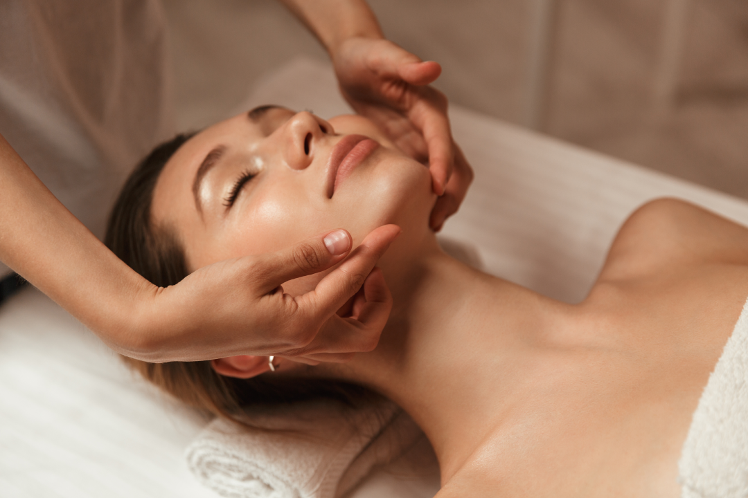 Professional facial massage during a ZO Stimulator Peel session for rejuvenated skin.