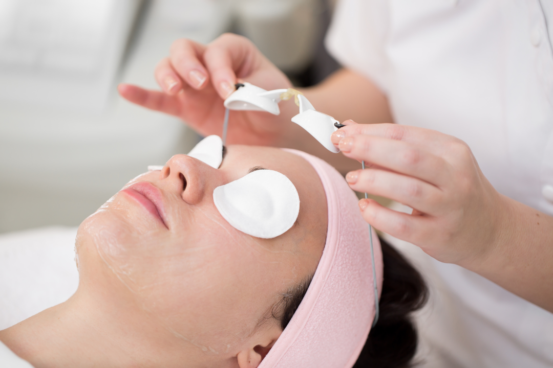 A client undergoing a professional sunspot removal procedure at a medical spa for flawless skin.